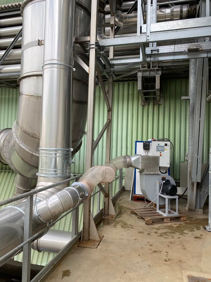 Stainless steel ductwork and a PURA unit on an industrial site