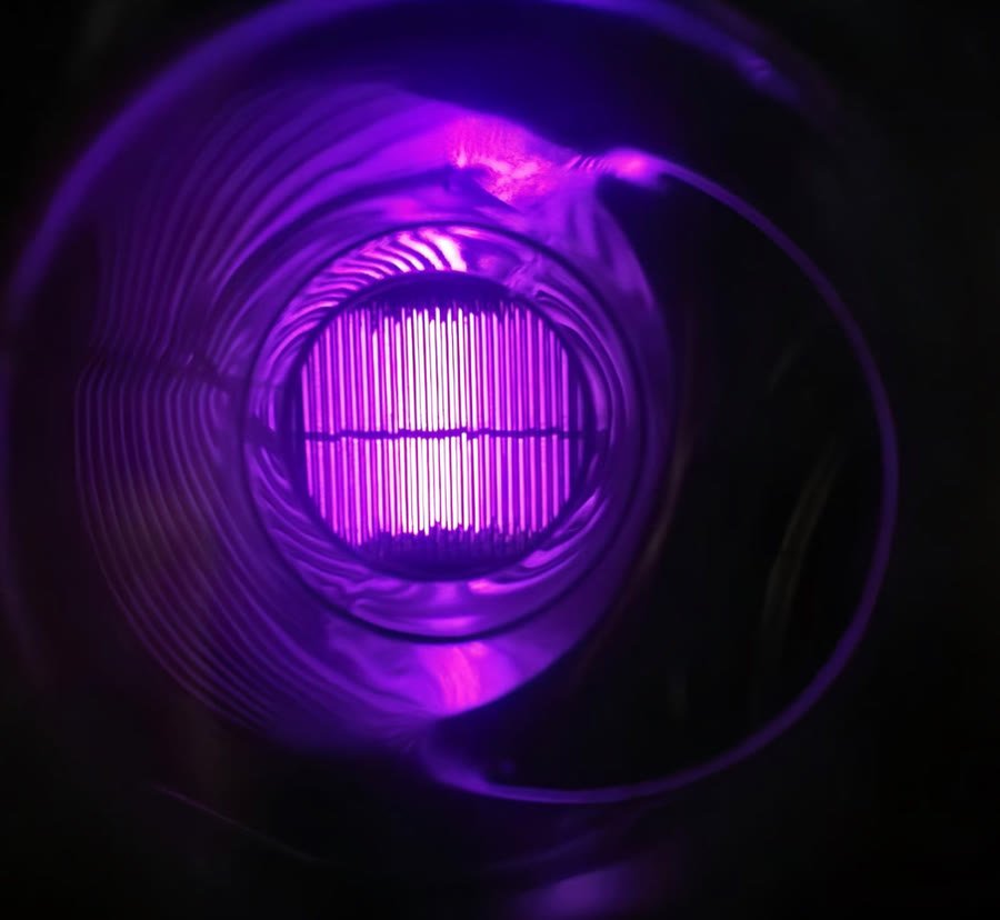 The violet plasma discharge photographed inside a PURA reactor
