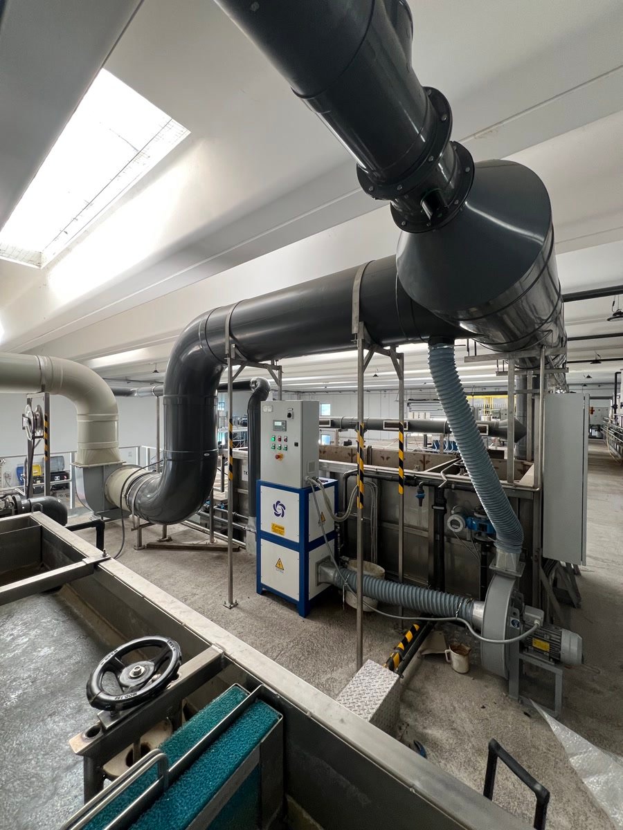 Process ductwork running to a PURA unit inside a production hall