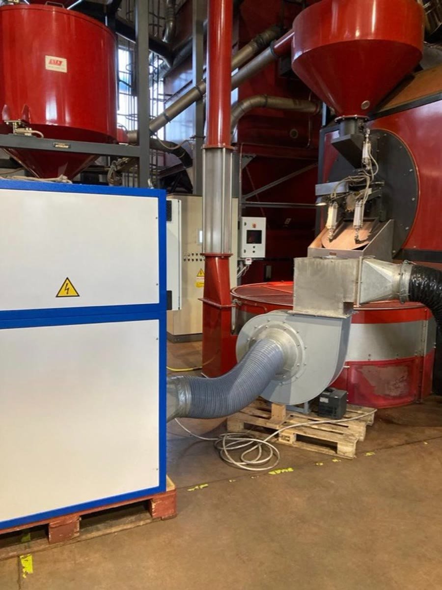 A PURA unit beside red roasting machinery